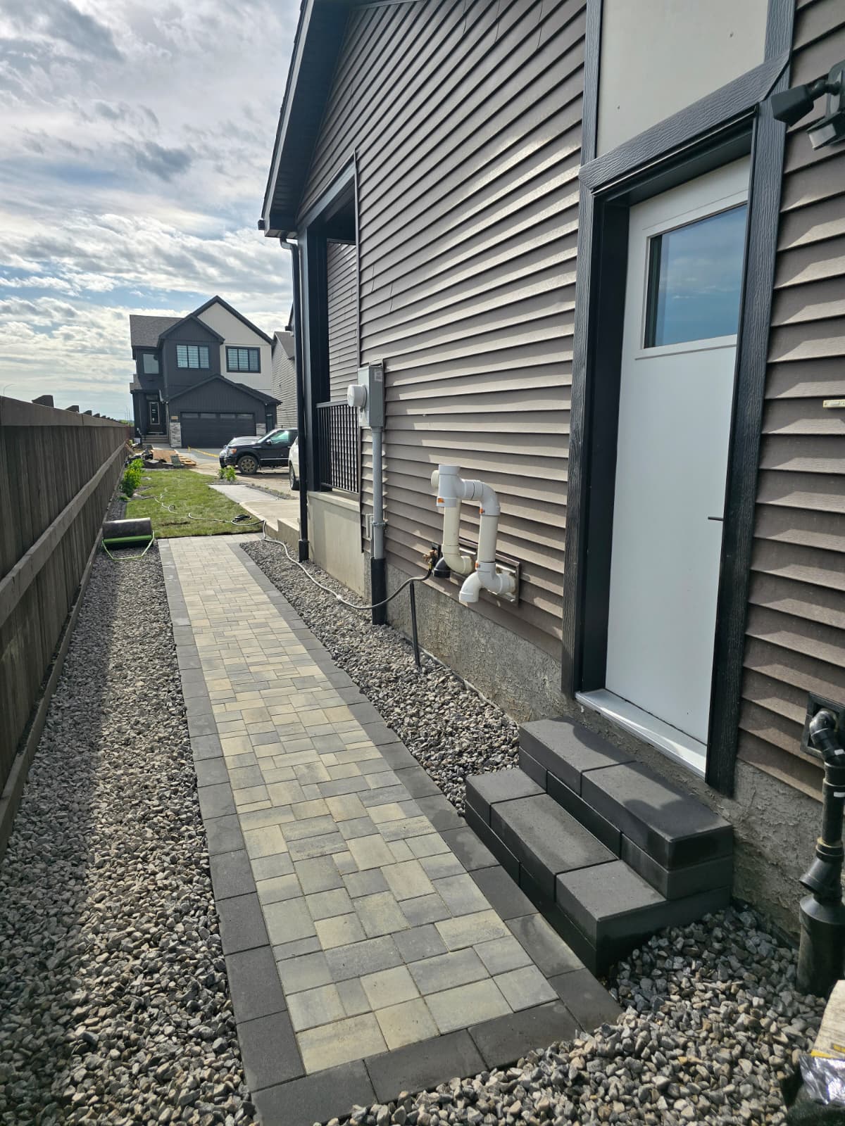 Hardscape pathway installation in sideyard — Edmonton