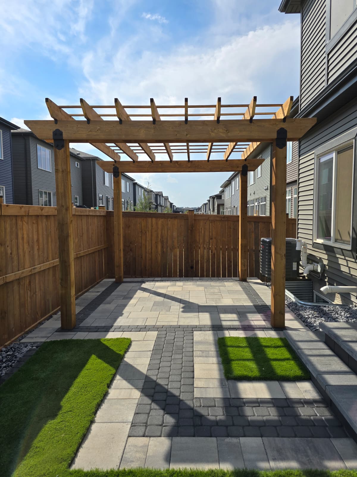 Cedar pergola and outdoor patio — Windermere Edmonton